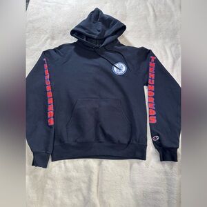 Champion Black Hoodie with Red Sleeve Text and Blue Chest Patch